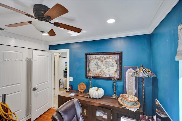 office space with ceiling fan, light hardwood / wood-style flooring, and crown molding