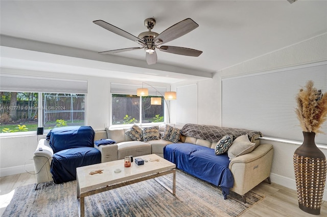 living room with light hardwood / wood-style floors and ceiling fan