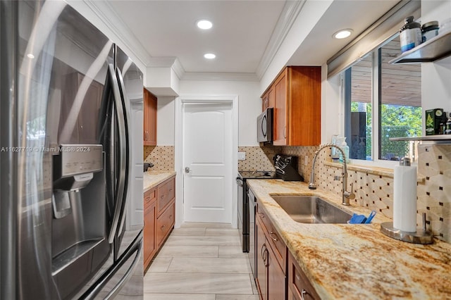 kitchen featuring appliances with stainless steel finishes, backsplash, crown molding, and sink