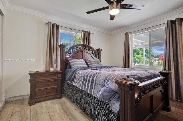 bedroom with ornamental molding, light wood-type flooring, and ceiling fan