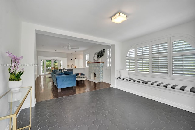 living room with ceiling fan and wood-type flooring