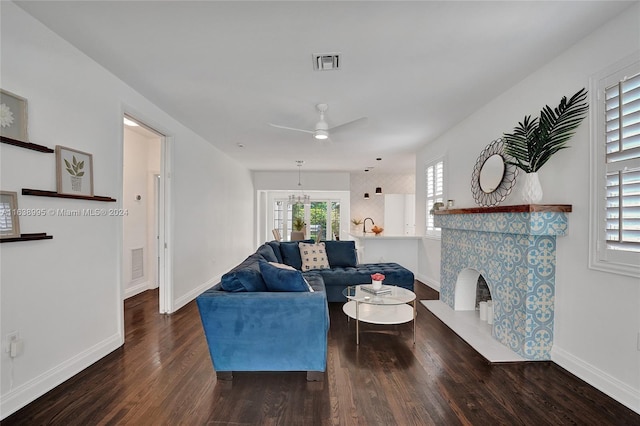 living room with a fireplace, hardwood / wood-style floors, and ceiling fan