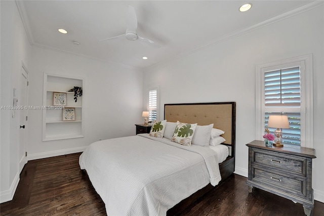 bedroom featuring ceiling fan, dark wood-type flooring, multiple windows, and crown molding