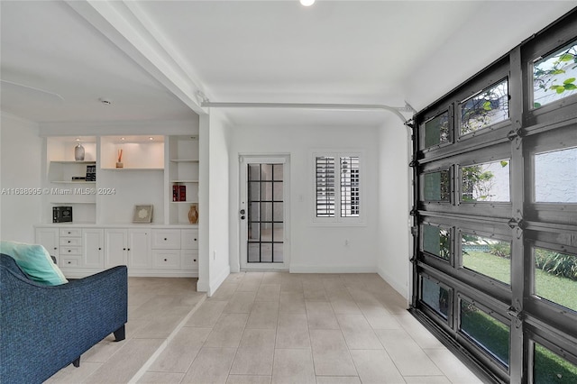 interior space featuring light tile patterned floors and a wealth of natural light