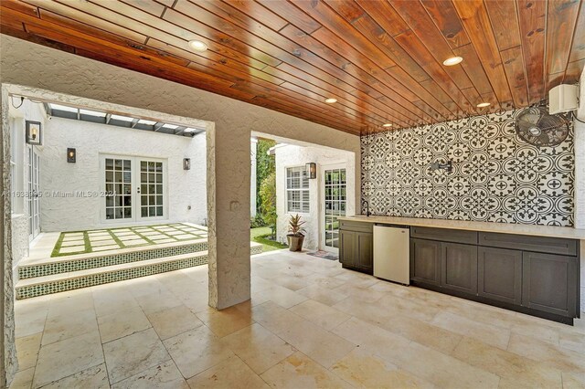 view of patio with french doors and sink