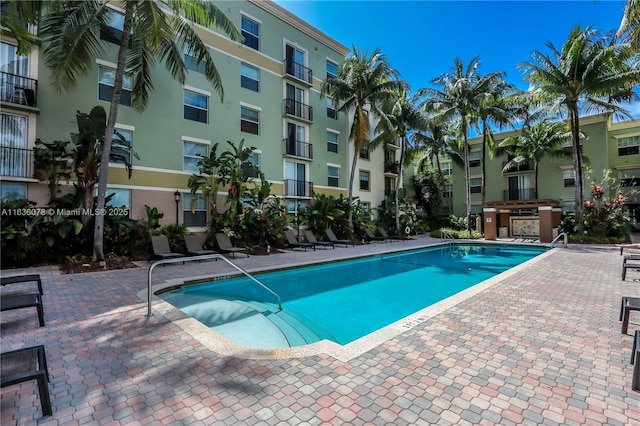 view of swimming pool with a patio area