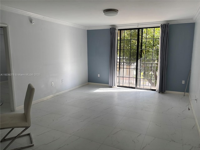 spare room with a wall of windows and ornamental molding