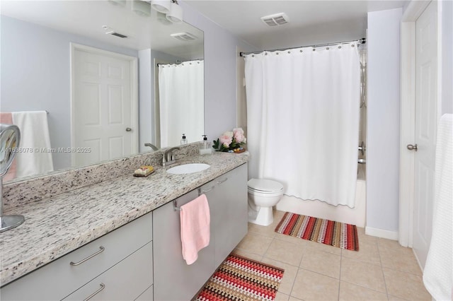 full bathroom with vanity, shower / bathtub combination with curtain, tile patterned floors, and toilet