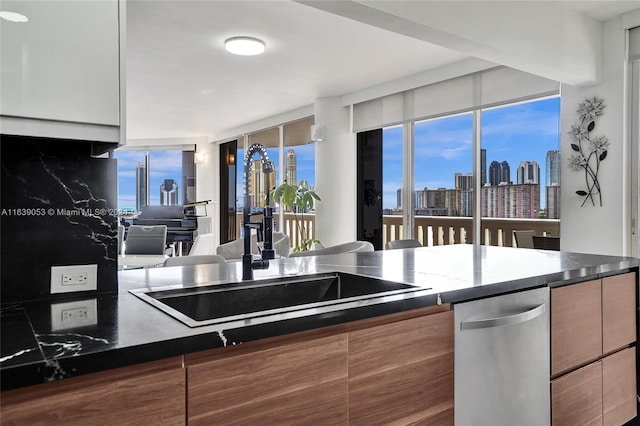 kitchen with sink and dark stone counters