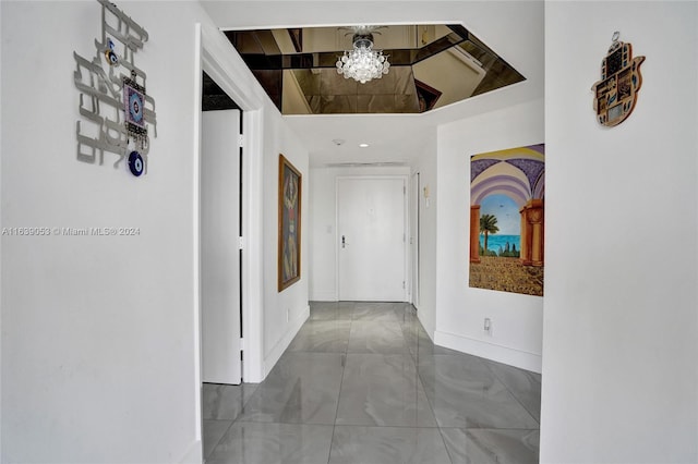 hallway featuring lofted ceiling