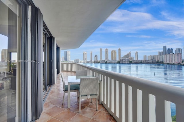 balcony featuring a water view