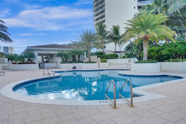 view of swimming pool with a patio area