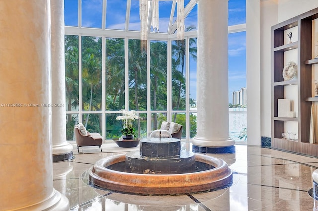 building lobby featuring a water view