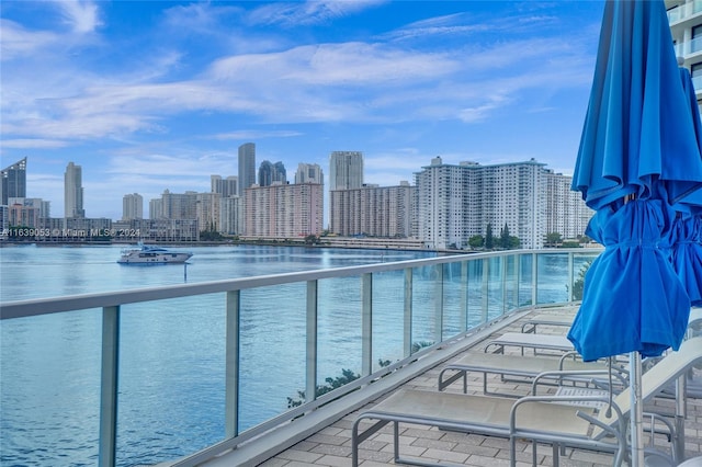 view of pool with a water view