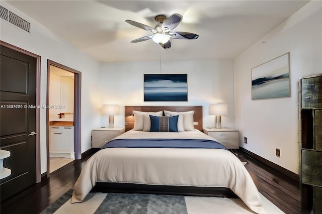 bedroom with dark wood-type flooring, ensuite bathroom, and ceiling fan