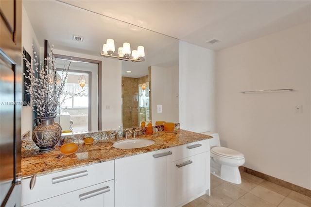 bathroom with a shower with door, tile patterned floors, toilet, vanity, and a chandelier