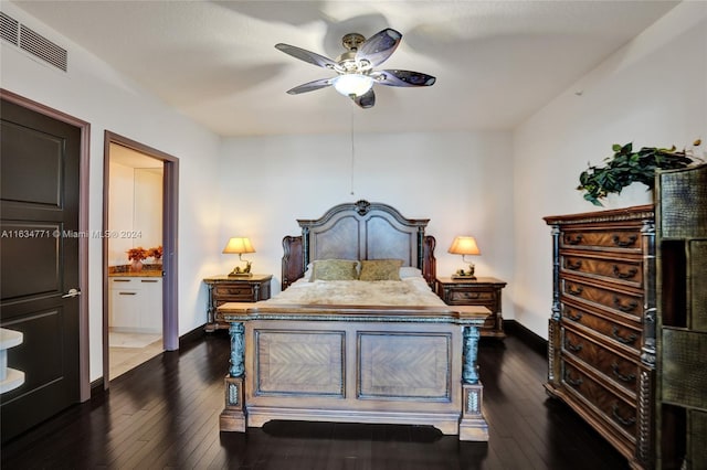 bedroom with connected bathroom, ceiling fan, and dark wood-type flooring