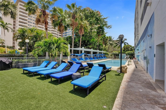 view of pool featuring a yard