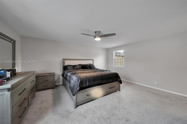 bedroom featuring ceiling fan and light carpet