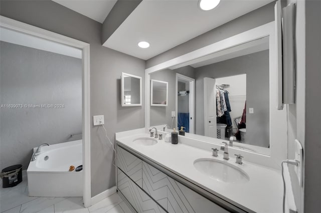 bathroom with vanity and a washtub