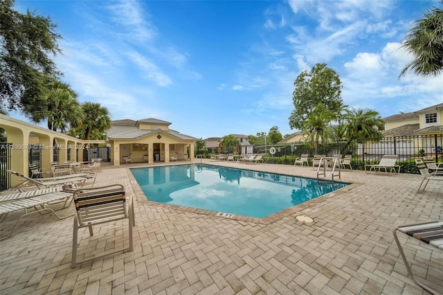 view of swimming pool featuring a patio area