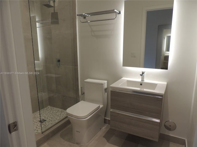 full bathroom with tile patterned flooring, vanity, toilet, and a shower stall