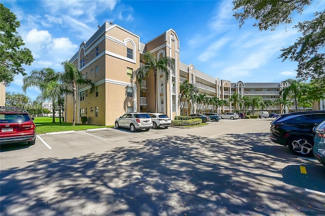 view of property with uncovered parking