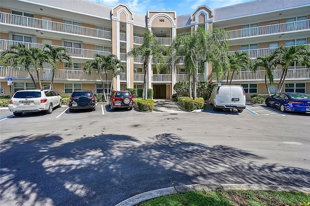 view of property with uncovered parking