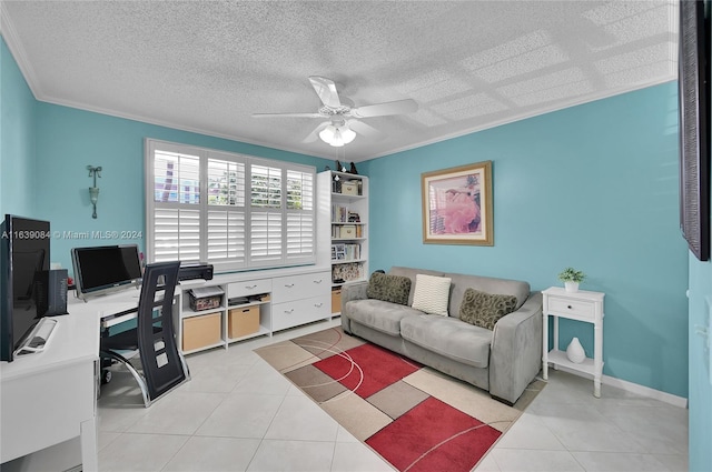 living room with ceiling fan, a textured ceiling, ornamental molding, and light tile patterned floors