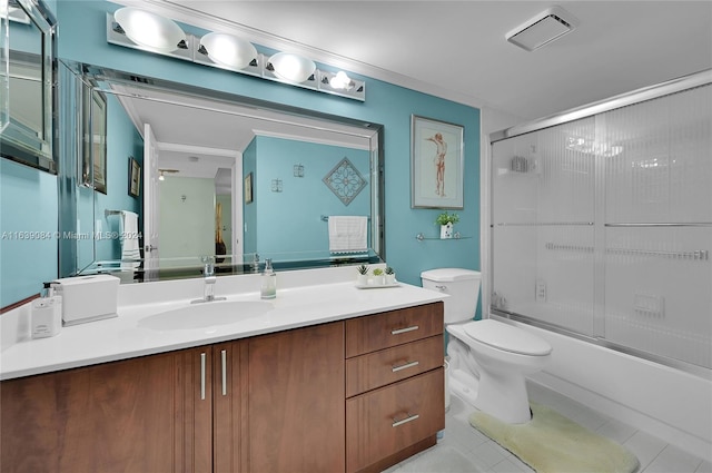 full bathroom with enclosed tub / shower combo, toilet, tile patterned floors, and vanity