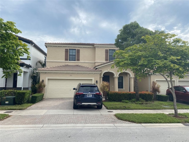 mediterranean / spanish-style house featuring a garage