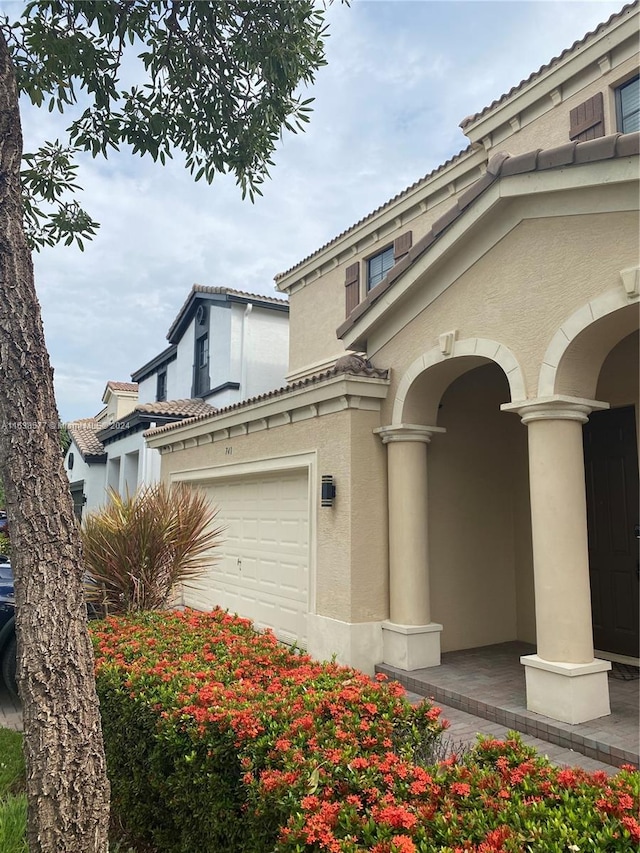 view of property exterior featuring a garage