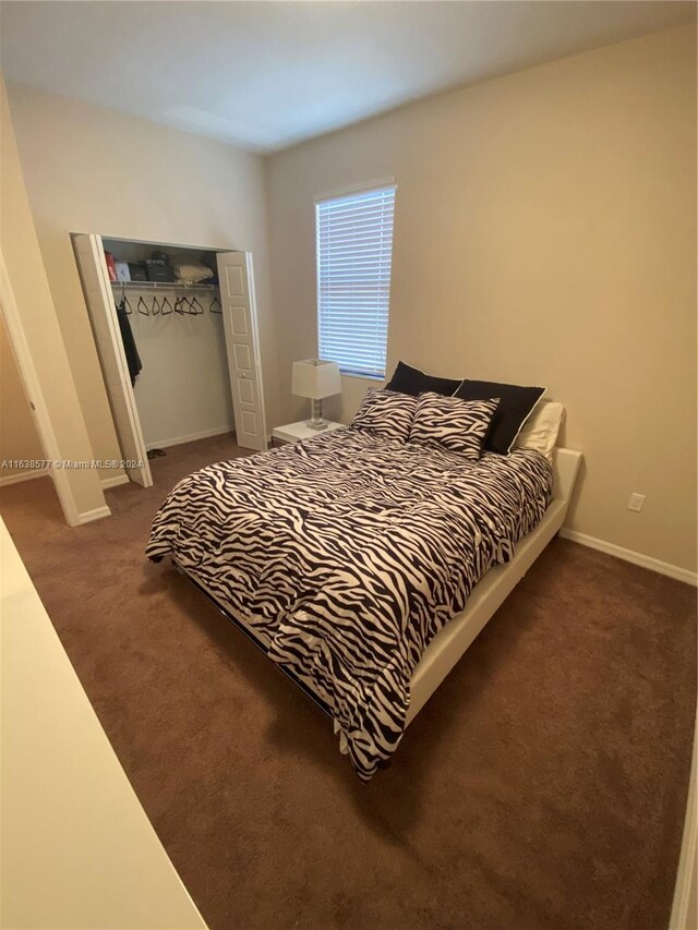 carpeted bedroom featuring a closet