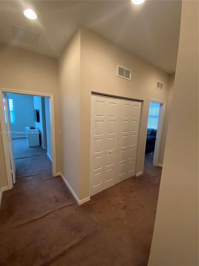 hallway featuring carpet