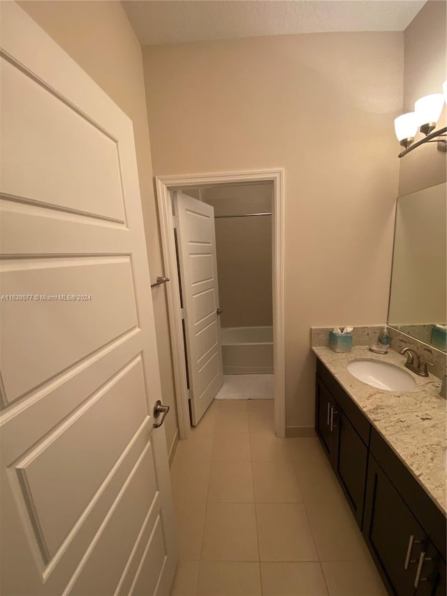 bathroom with vanity and tile patterned flooring