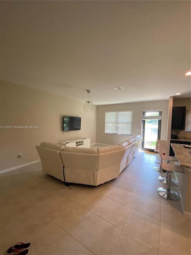 living room with light tile patterned floors