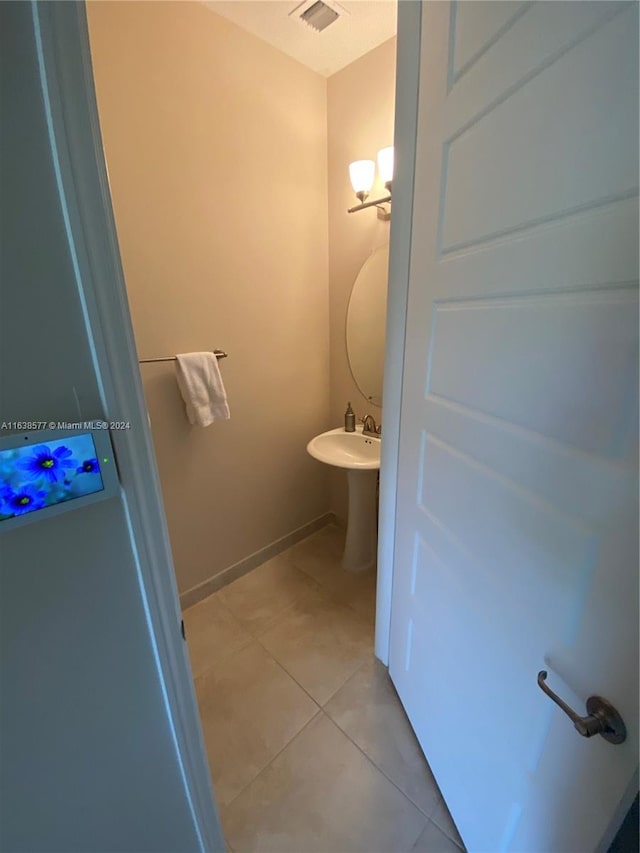 bathroom featuring sink and tile patterned flooring