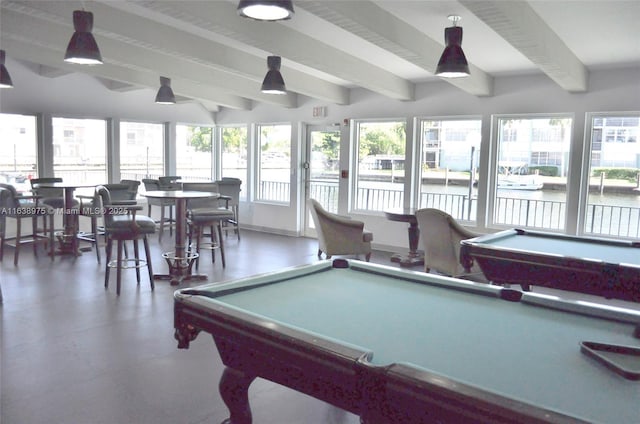 game room featuring billiards, beamed ceiling, and a healthy amount of sunlight