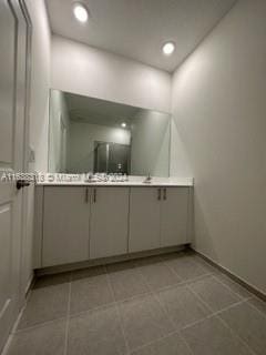 bathroom with vanity and tile patterned flooring