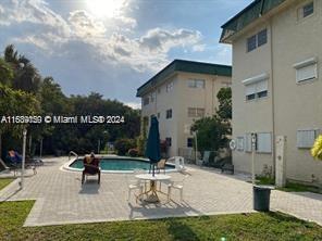 1450 Atlantic Shores Blvd Unit 201, Hallandale Beach, FL 33009 - community pool with a patio