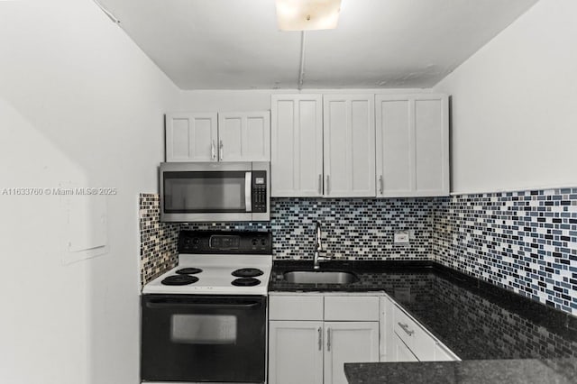 kitchen featuring electric stove, sink, decorative backsplash, and white cabinets