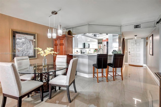 dining area with light tile patterned floors