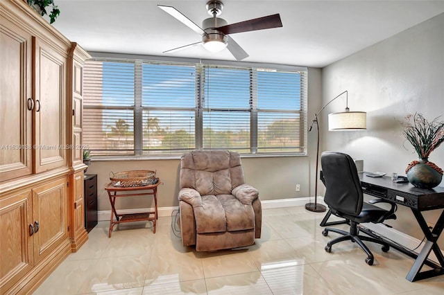 tiled office space featuring ceiling fan