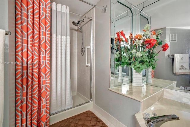 bathroom with tile patterned floors and curtained shower