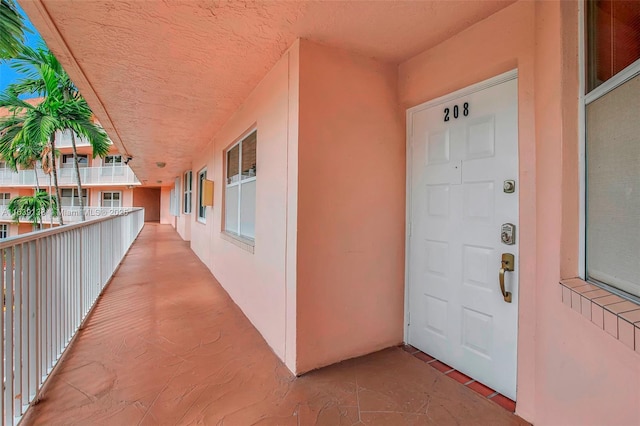 entrance to property featuring a balcony