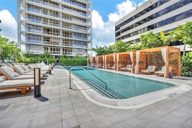 view of swimming pool featuring a patio