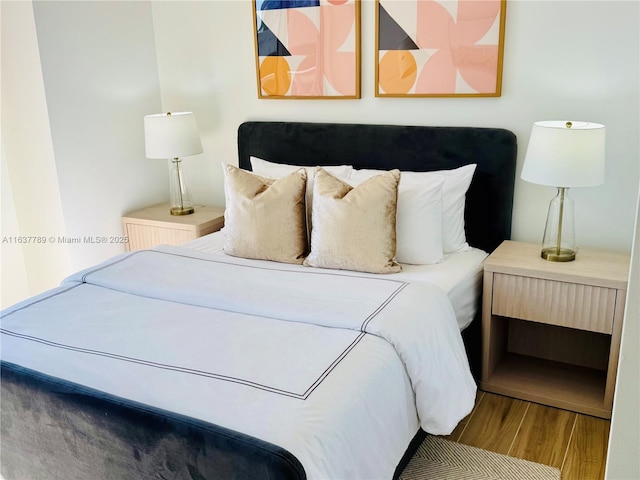 bedroom featuring wood finished floors
