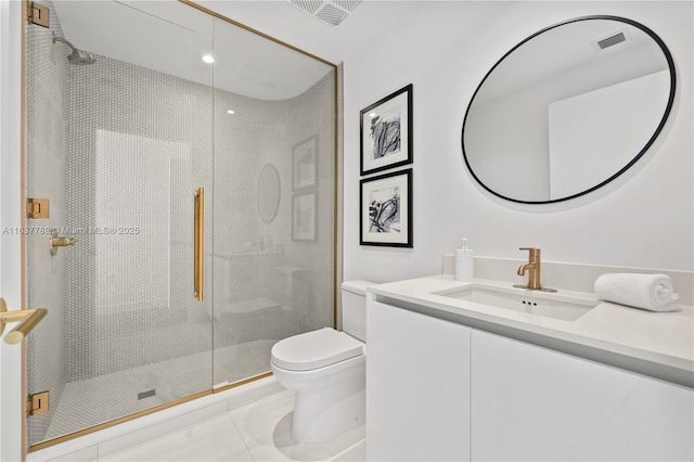 bathroom featuring tile patterned flooring, vanity, toilet, and an enclosed shower