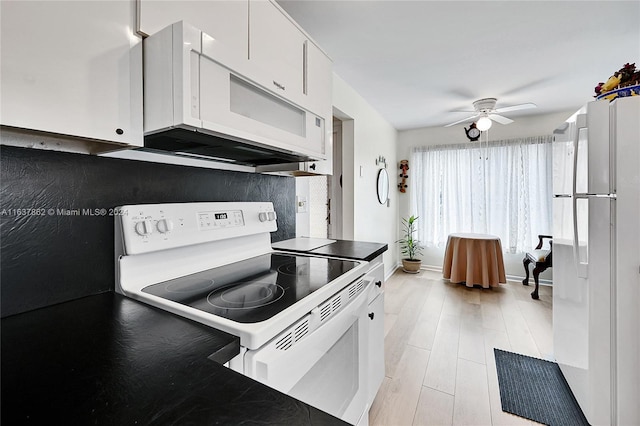 kitchen with white appliances, light hardwood / wood-style floors, white cabinetry, and ceiling fan