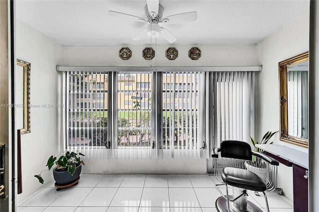 sunroom featuring ceiling fan